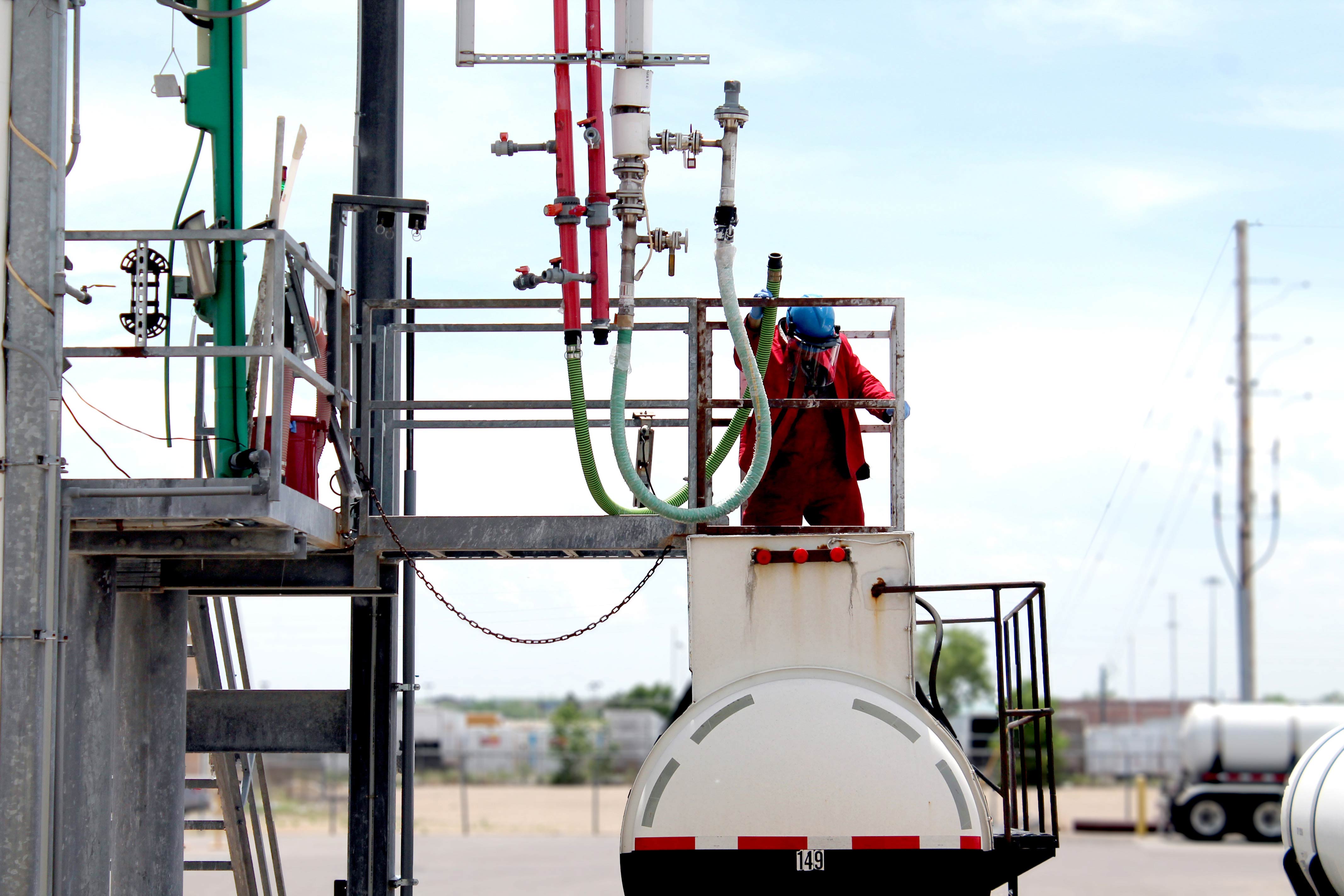 Material Handler Operator Loading A Truck